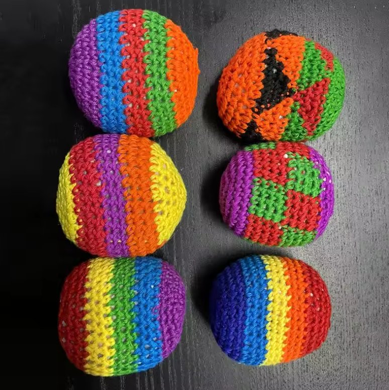 Hacky sack and footbag collection with dirtbag-style control footbag and colorful crocheted hacky sacks